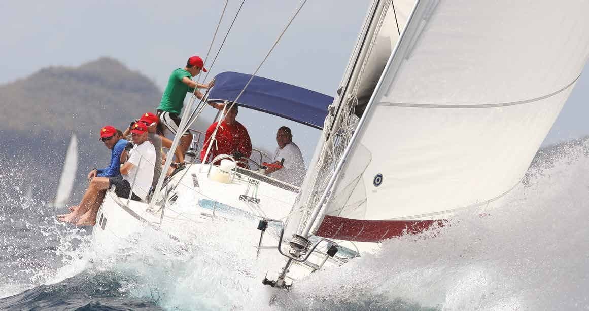 Race crew hiking upwind