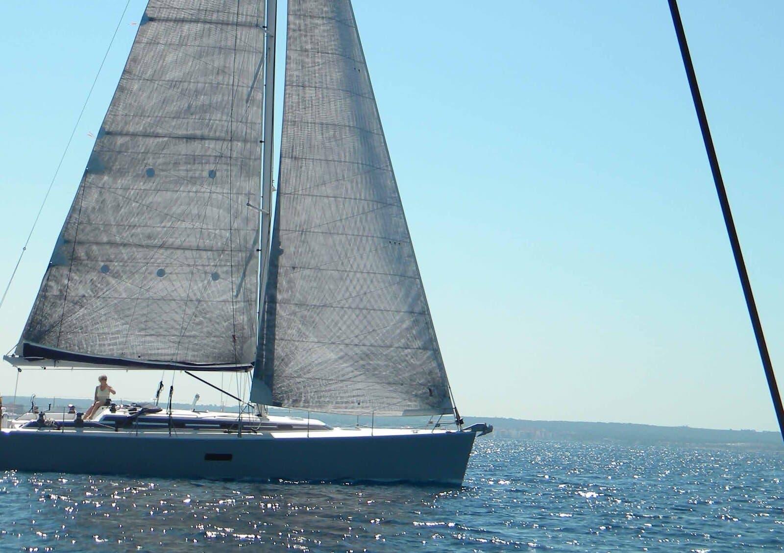 Yacht motoring through waves